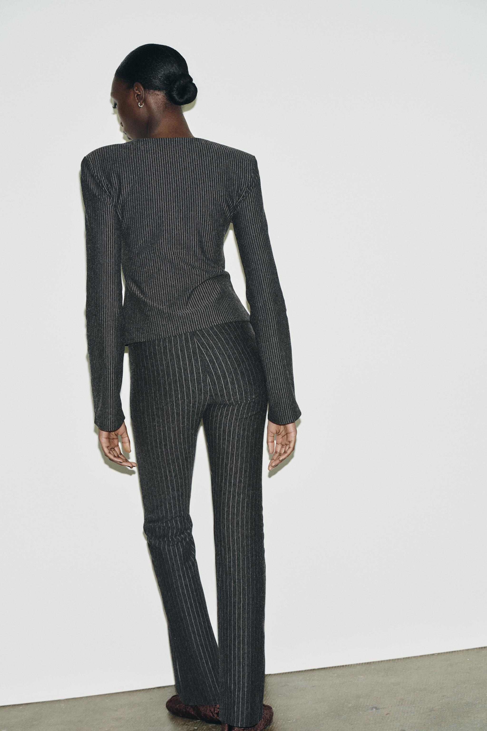 PINSTRIPED SHOULDER PAD TOP